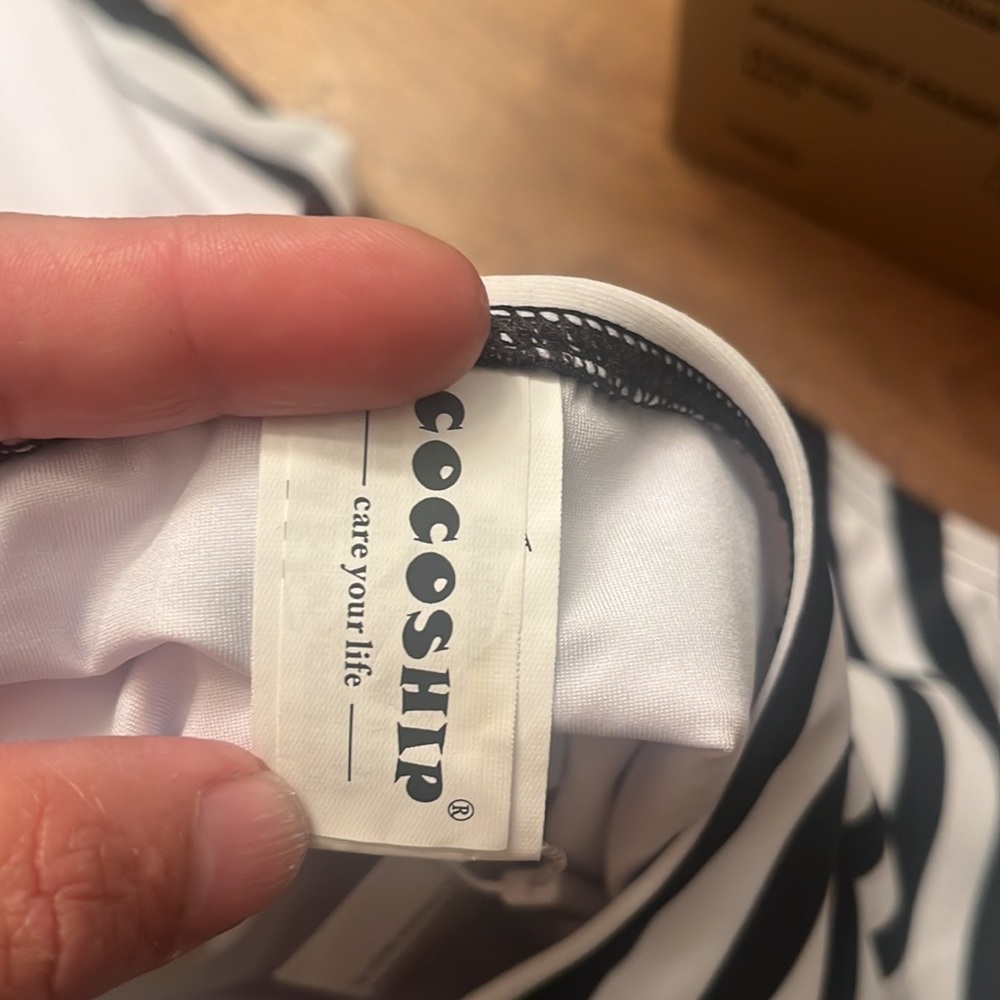 NWT Cocoship Swim Suite 
82% Nylon, 18% Elastane
Care Instructions
Hand Wash On - Picture 5 of 8